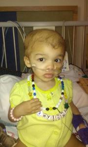 My'isha with her first completed Beads Of Courage necklace